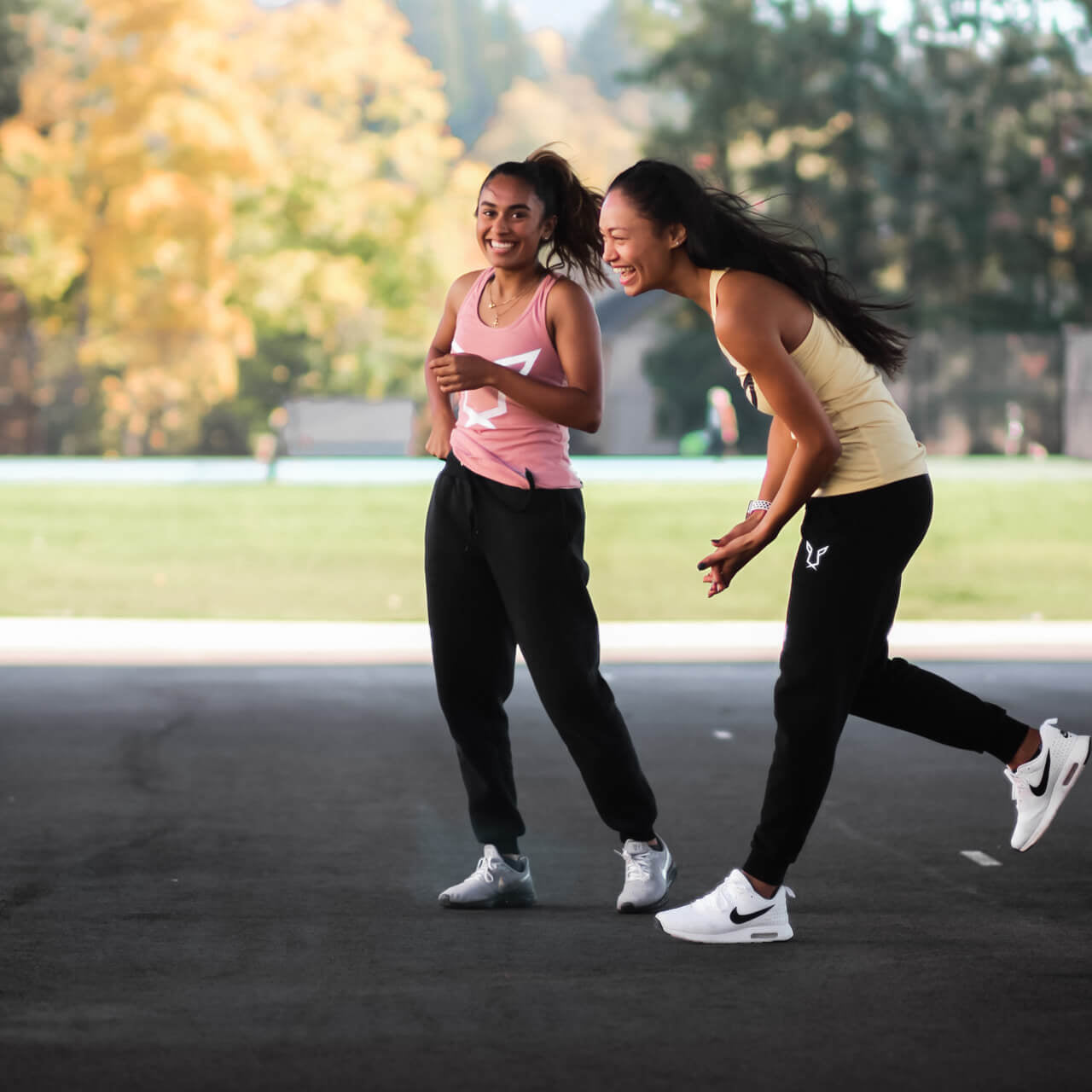 Women's Odisi Apparel models laughing in the Primal Collection