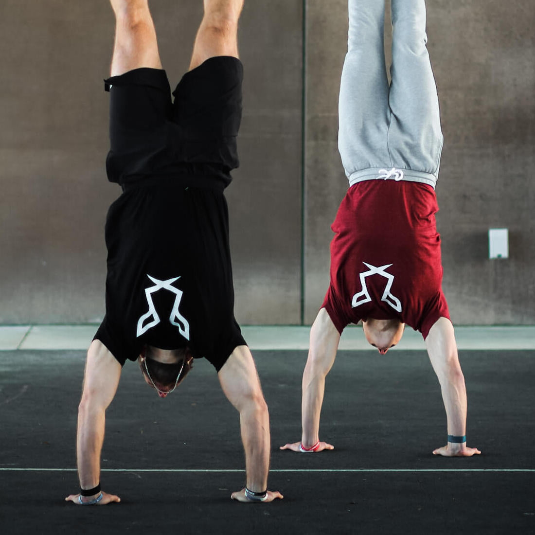 Jake & Sam Bredenbeck | Founders of Odisi Apparel doing handstands and enjoying their Odisi in the Primal Collection
